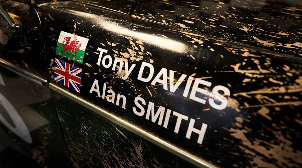 Close up of the 1963 MG 1100 ralley car with Tony Davies and Alan Smith's names and the Welsh and British flag respectively